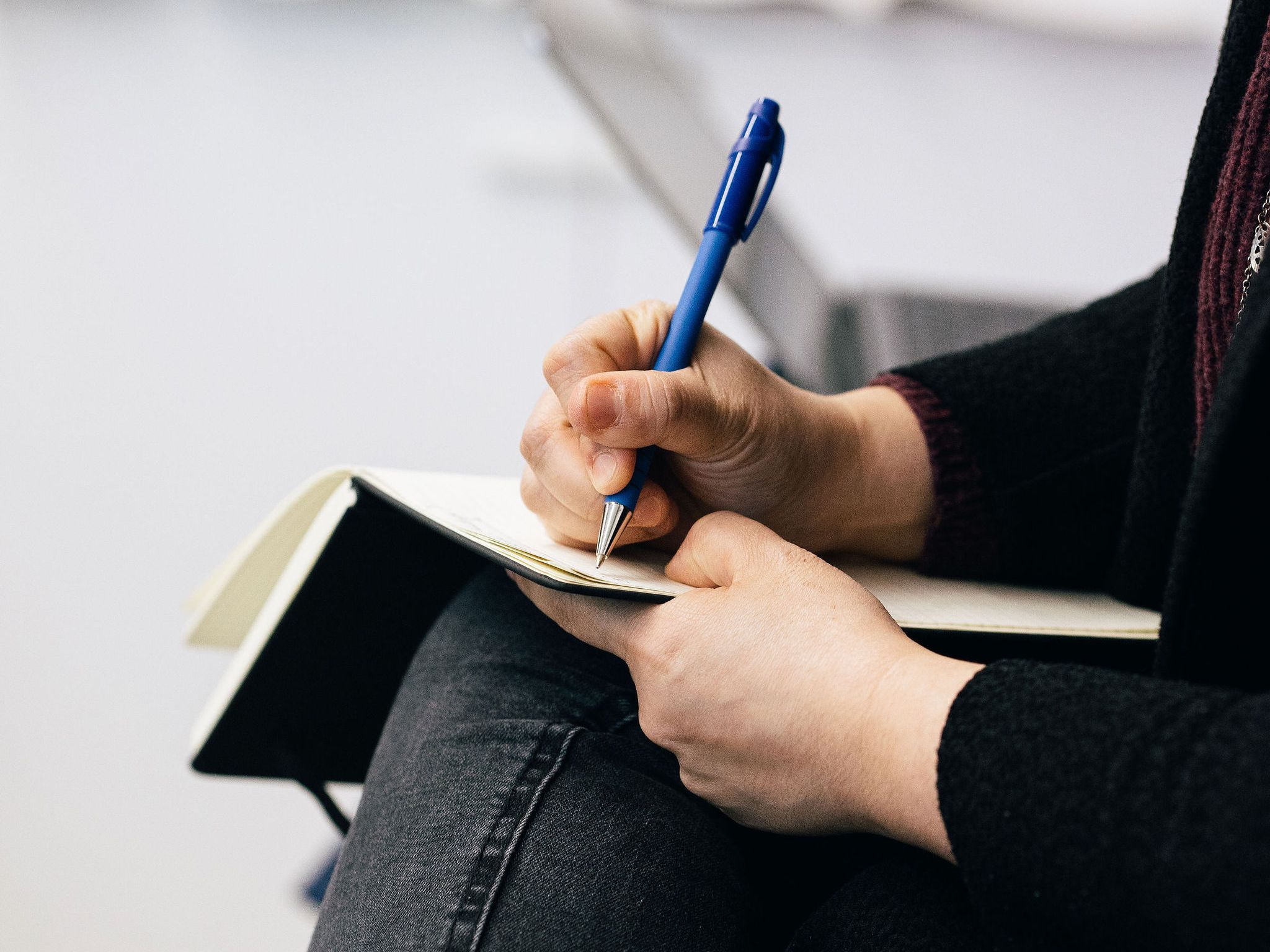 woman taking notes