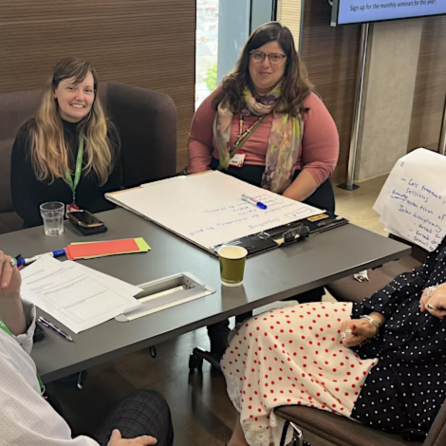 Picture taken of 4 people sitting around a table