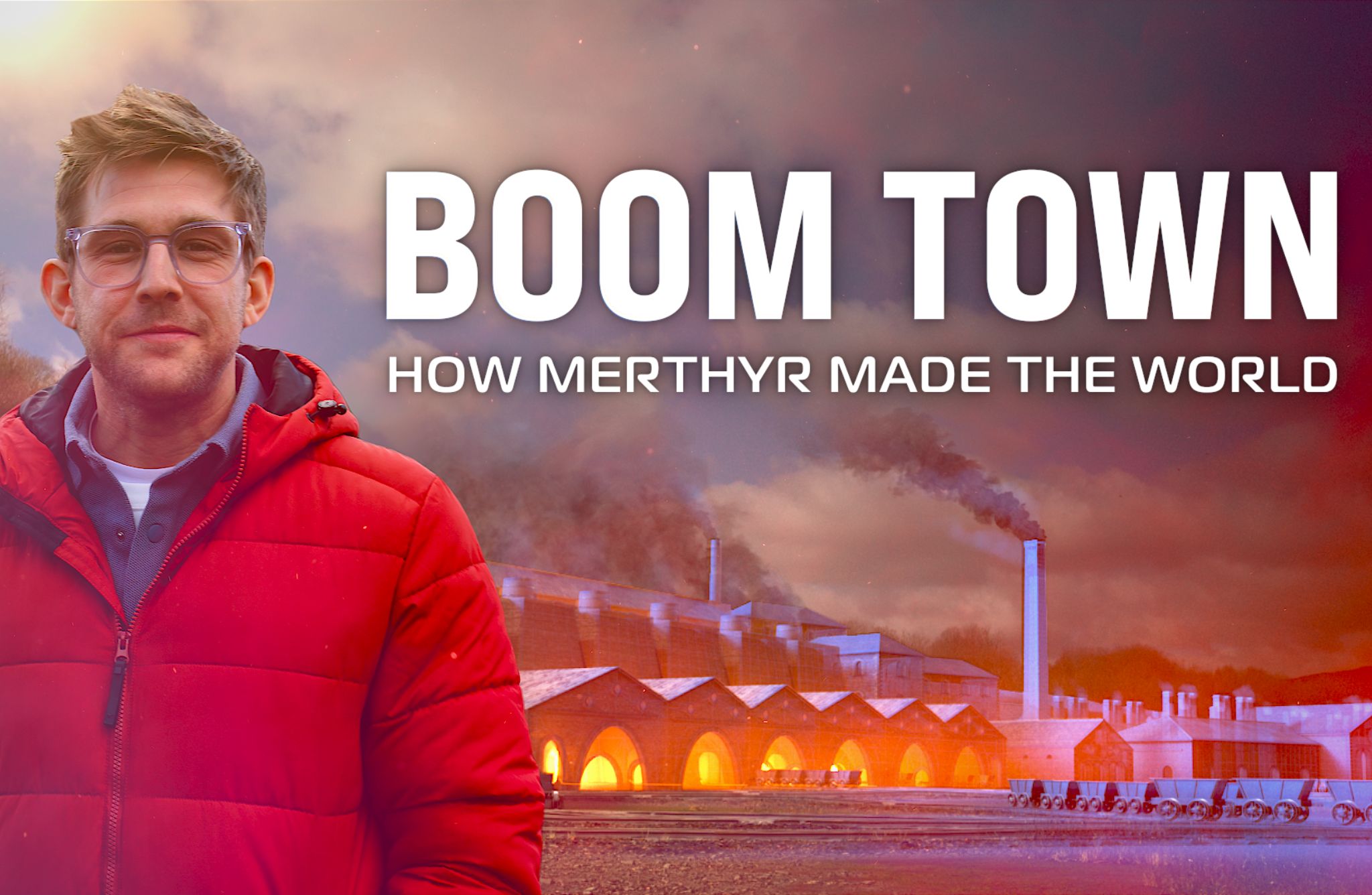 A man in a red jacket stands in front of an industrial scene with smoke rising from chimneys. The background shows a row of arched structures illuminated by orange light. The sky is filled with clouds and smoke, creating a dramatic atmosphere. Large white text at the top reads 'BOOM TOWN' and smaller text below it reads 'HOW MERTHYR MADE THE WORLD.'